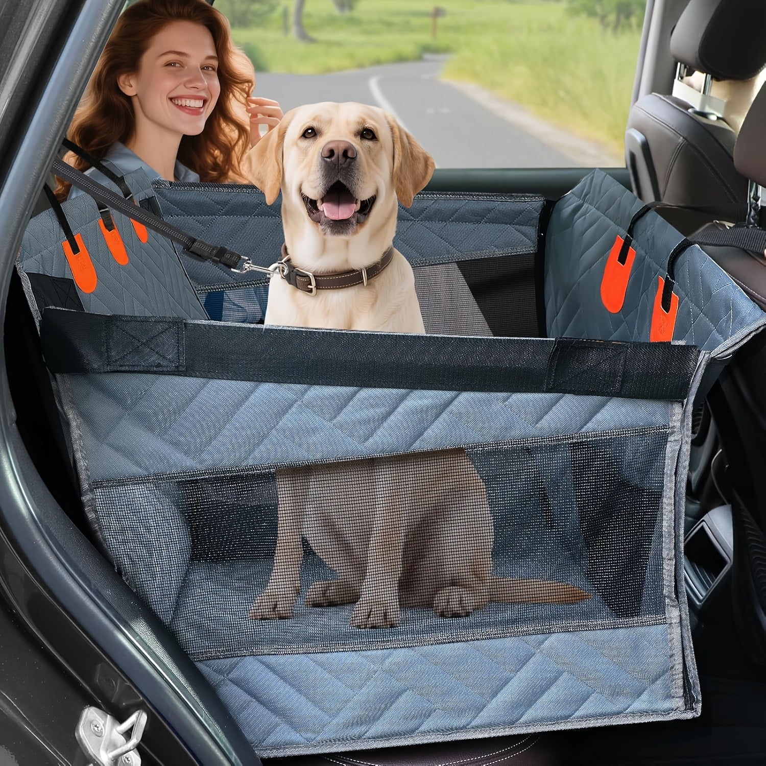 Dog sitting in a car with a single rider from The Pupy brand/ pet safety barrier, smiling woman in the background